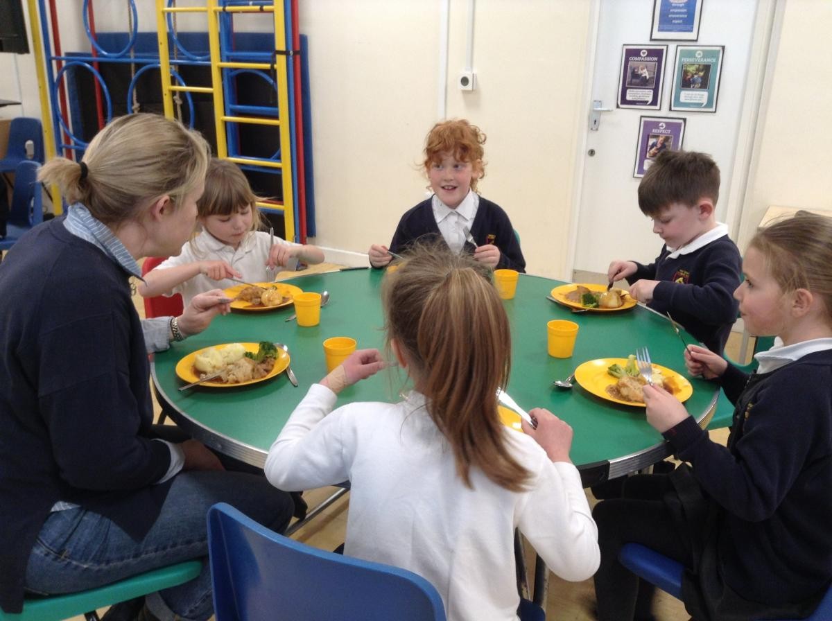 Governors sharing lunch with the children