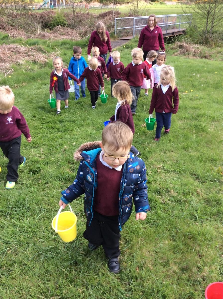 Walking back to school with our buckets of water.