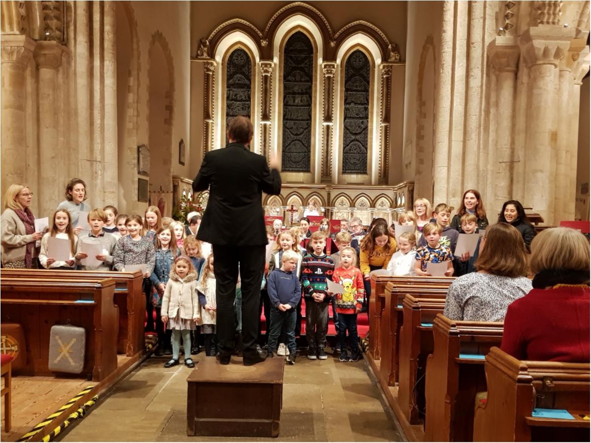Choir, with conductor, singing in church
