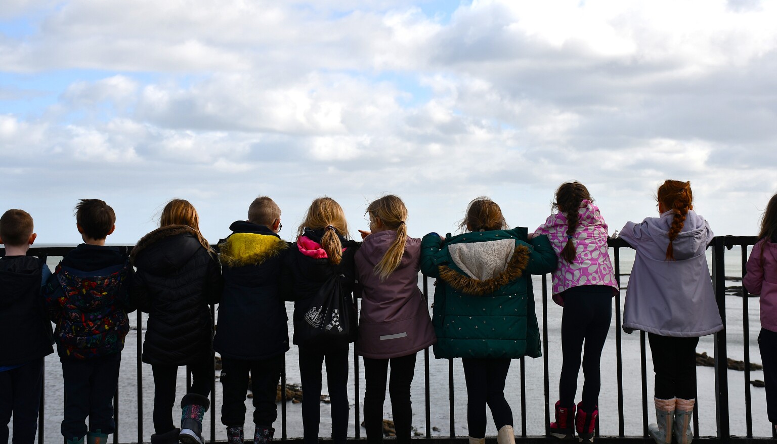 children looking out to sea