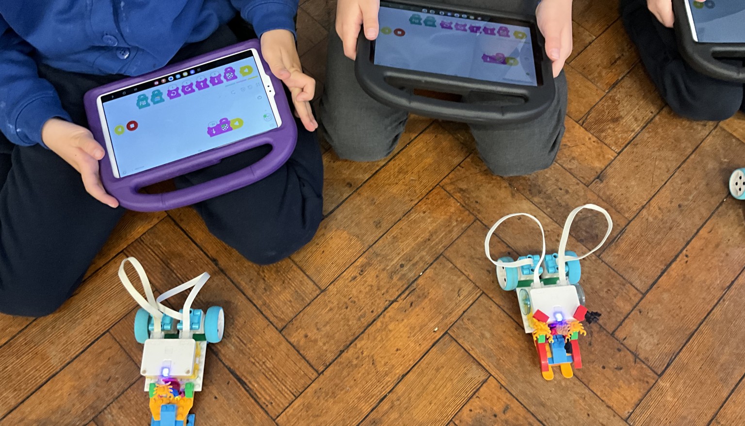 Children using tablets during STEM activity 