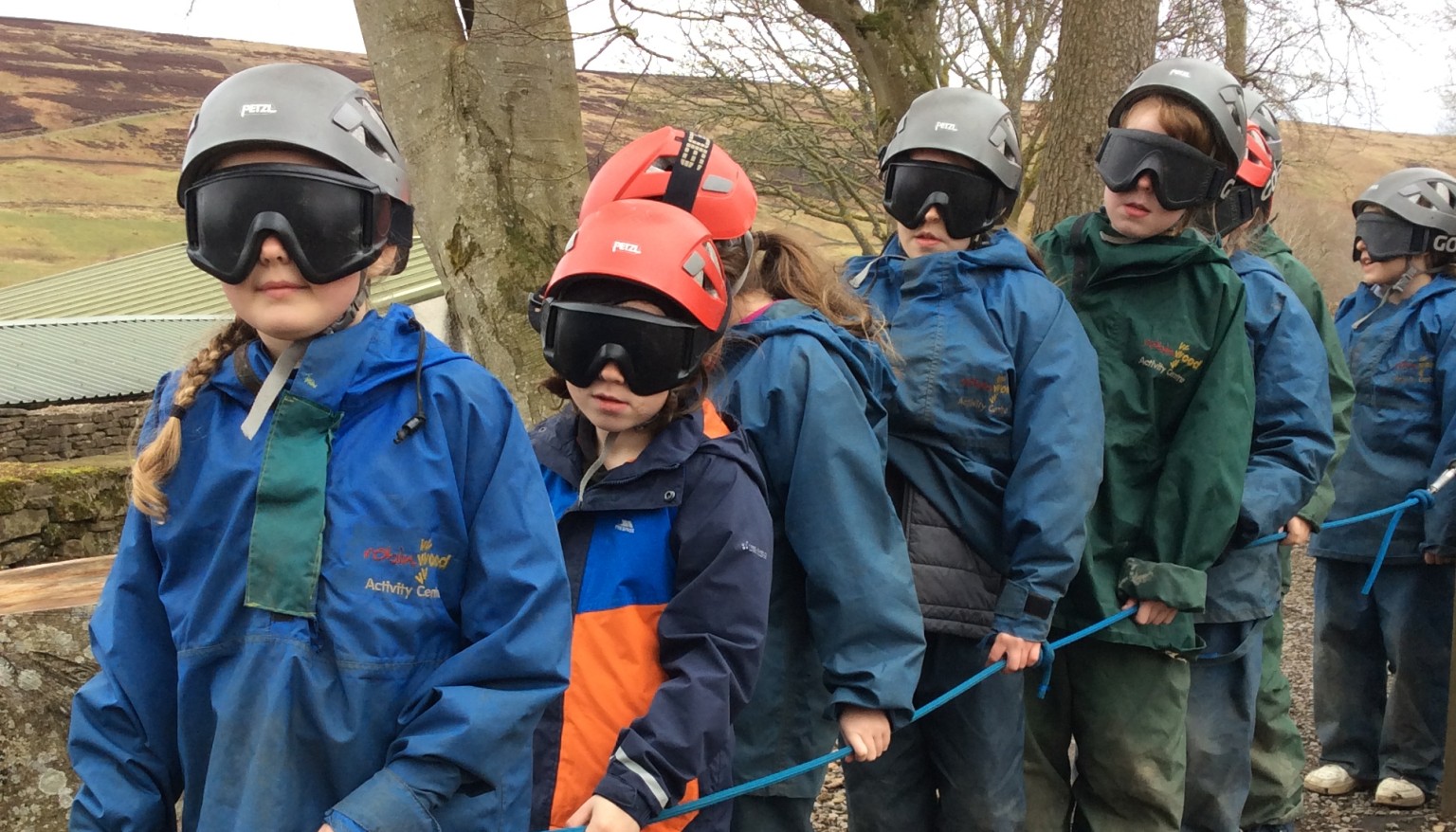 Children stood in s line wearing googles