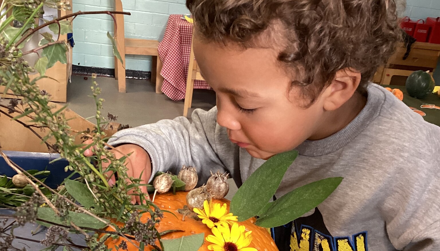 boy looking at flowers