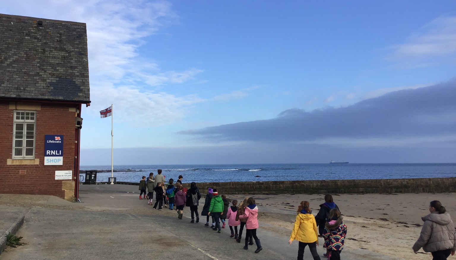 Children walking on the beach