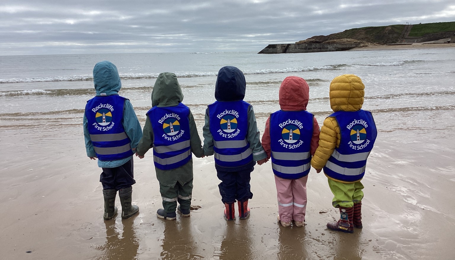 Children looking out at seas