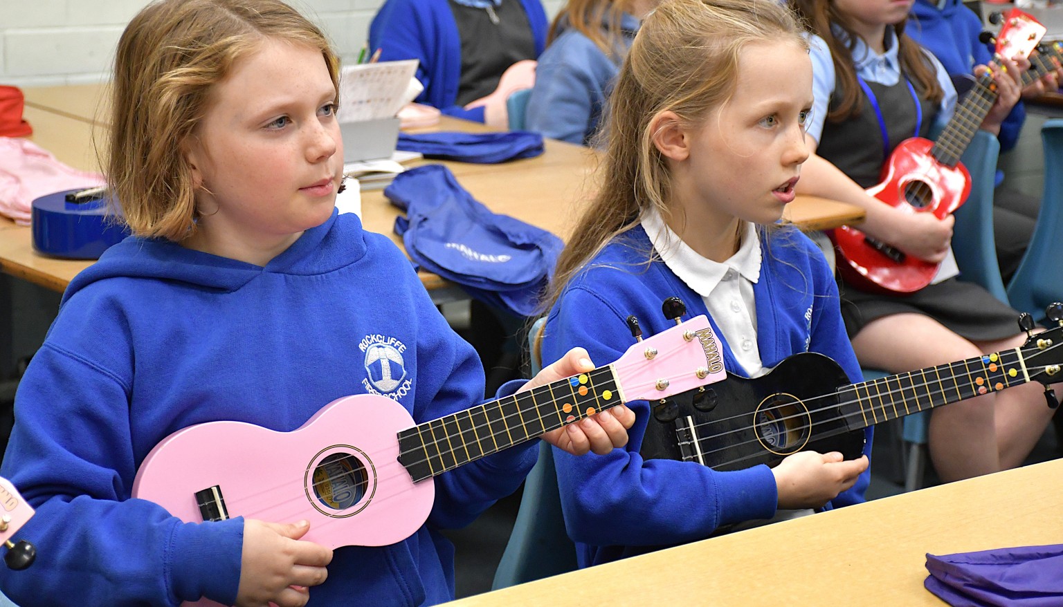 girls playing ukelele