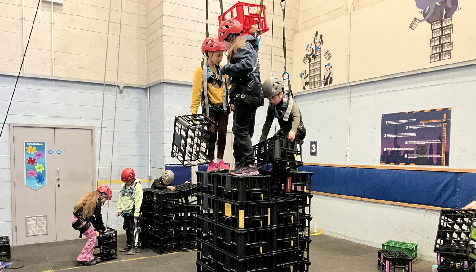 children on crate stack