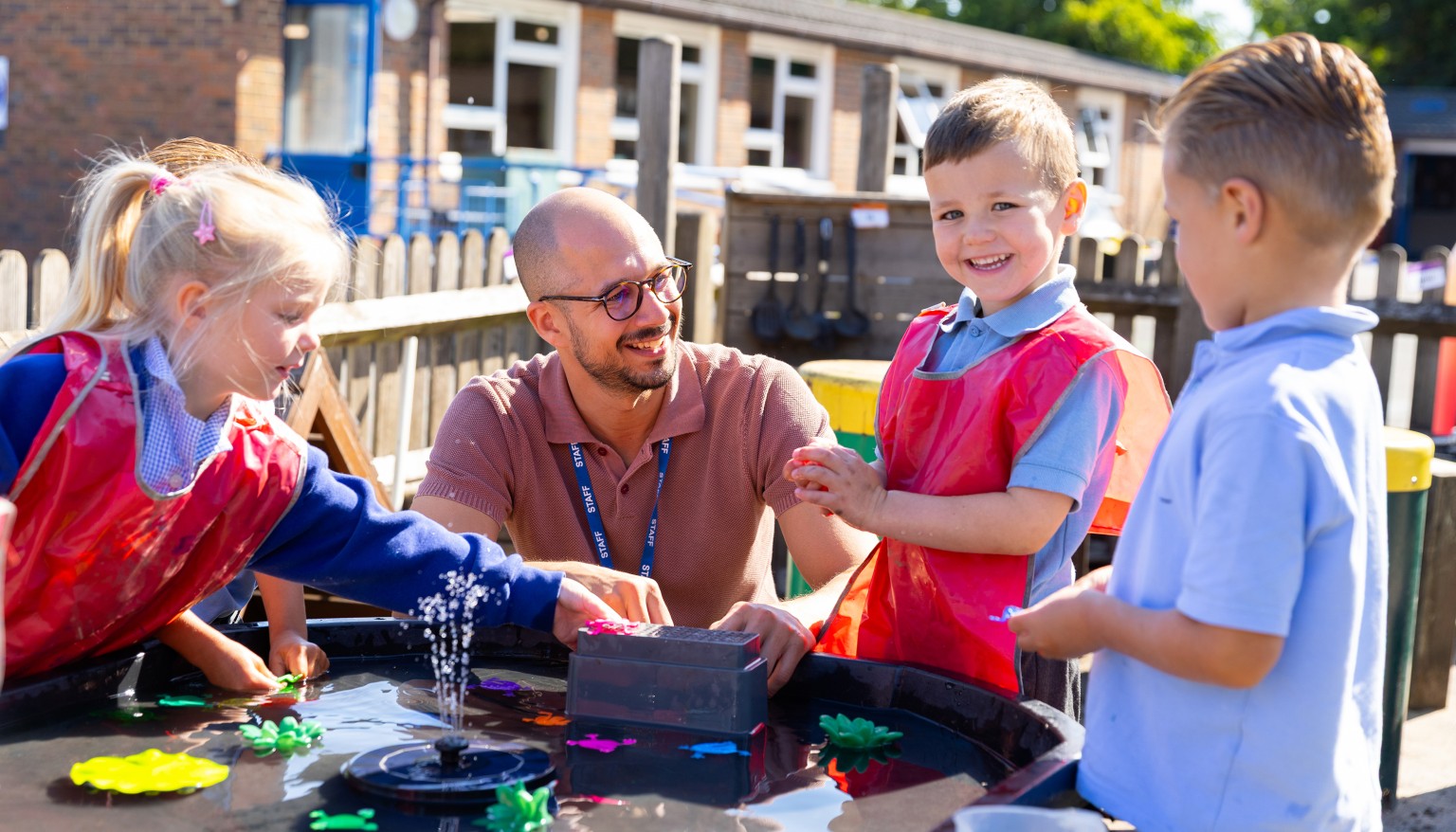 Children engaged in art activity outdoors