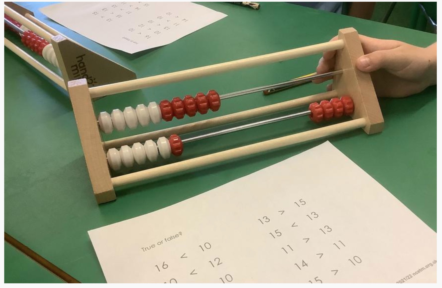 Children using rekenreks to compare numbers