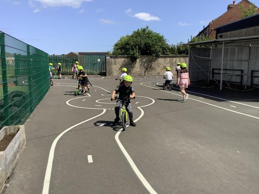 Pupils on scooters