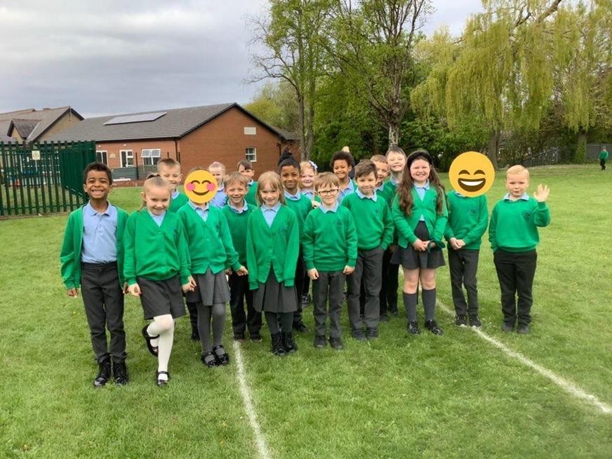 Smiling pupils on the running track