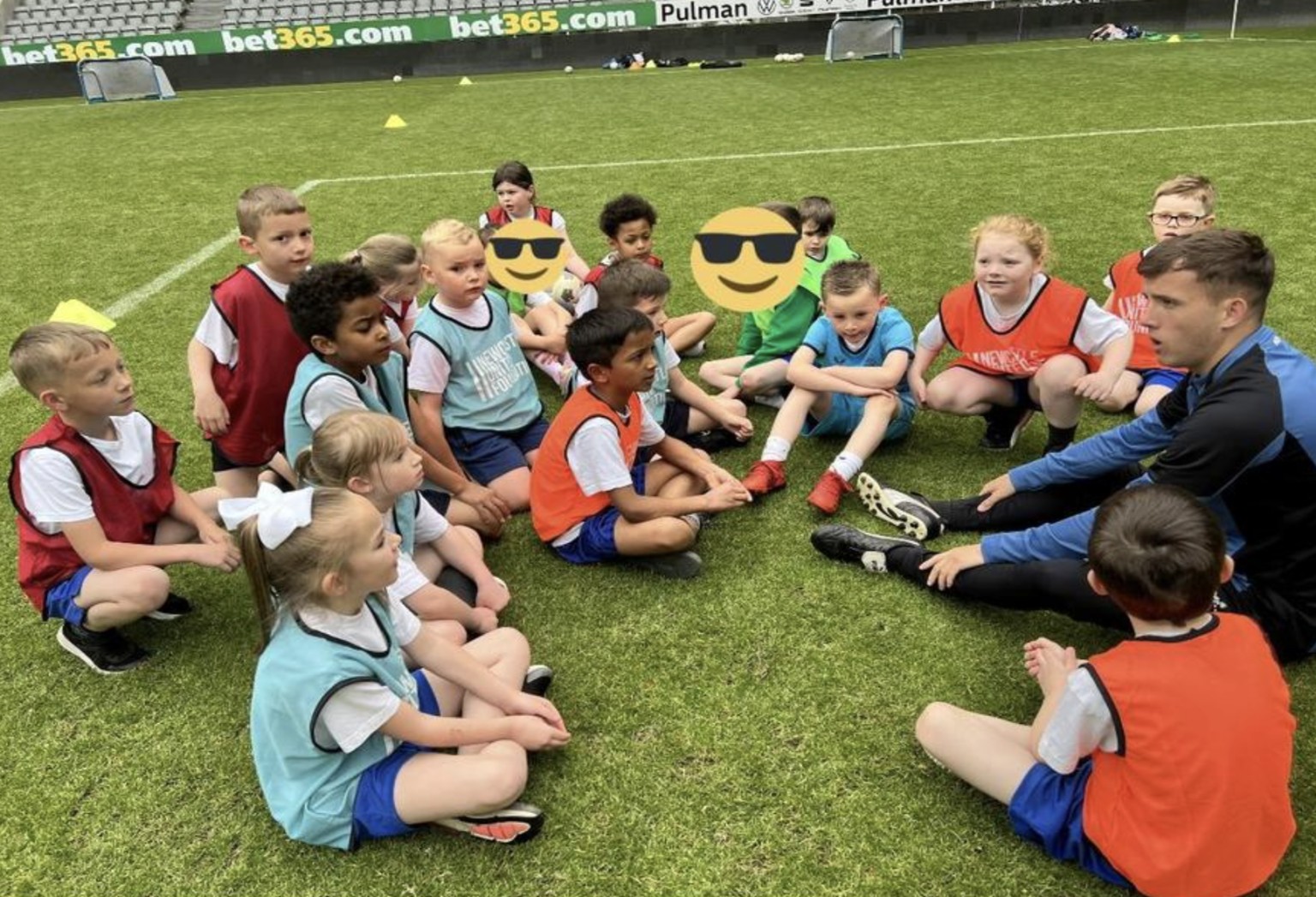 Smiling pupils, on the pitch, at St James' Park