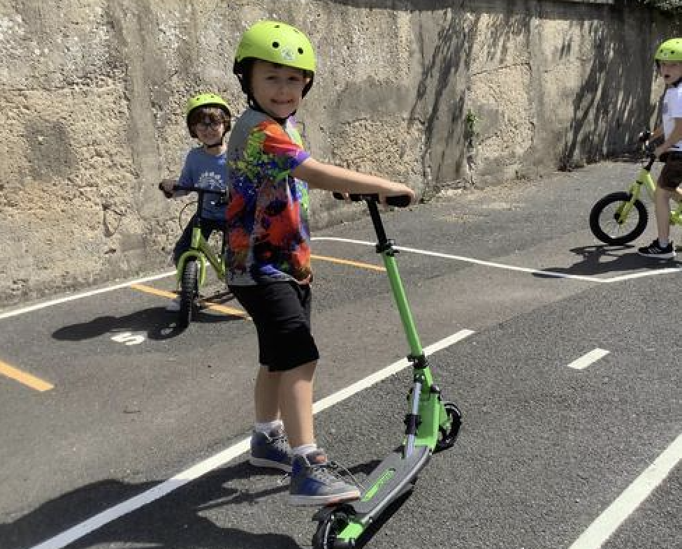Pupils on scooters on scooter track