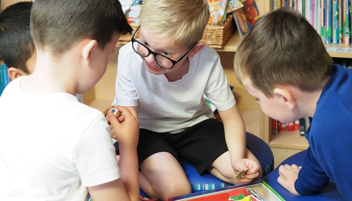Pupils playing board games