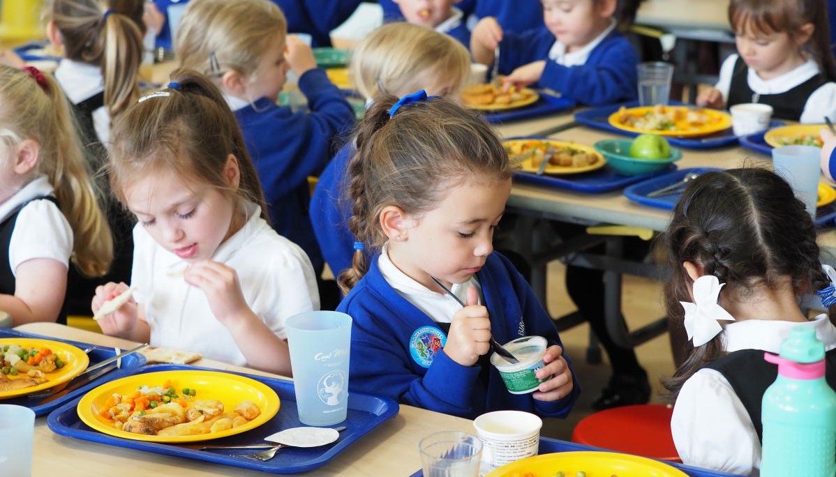 Pupils enjoying lunch together