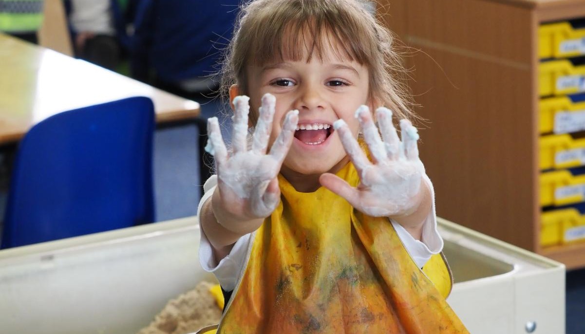 Pupil with messy hands