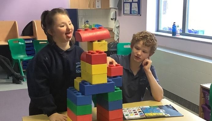two children building with blocks