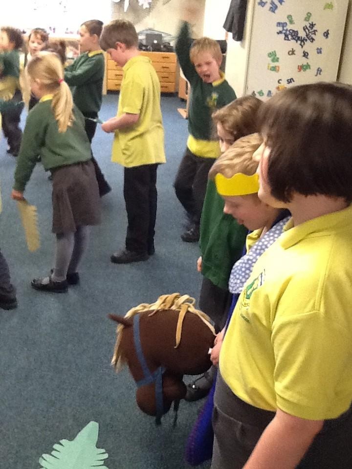 With great excitement, shouting and waving of palm leaves.