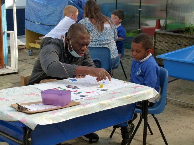 Pupil being supported in their Maths learning