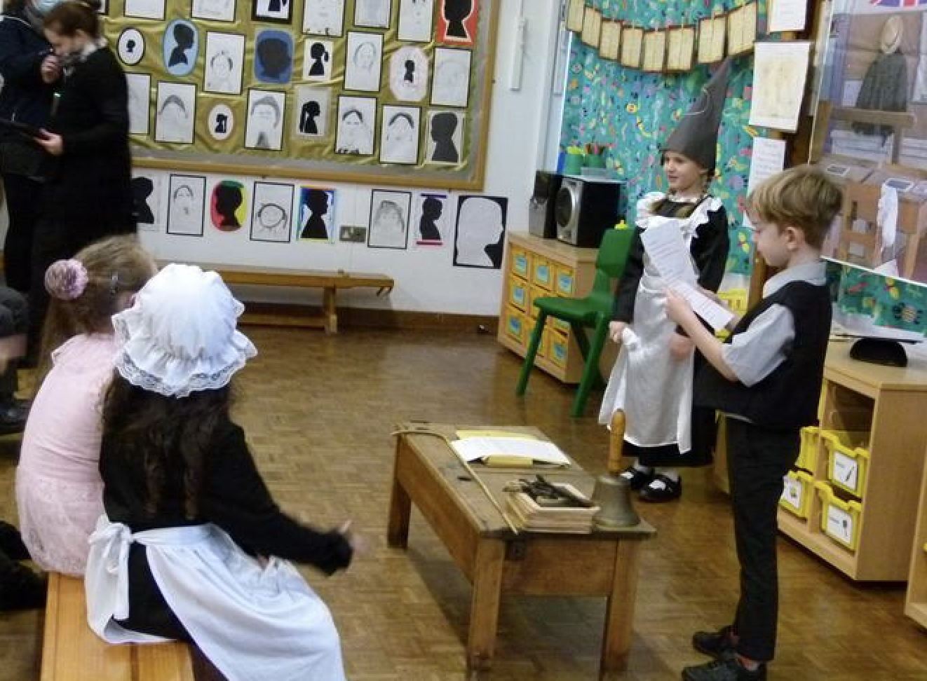 Pupils role playing Victorian children