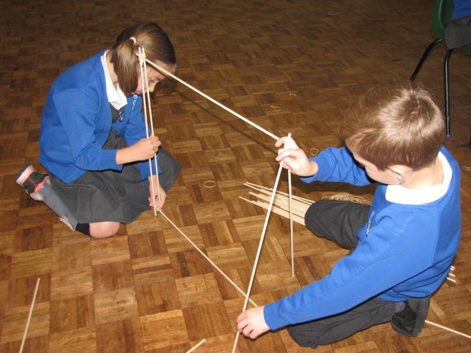 Pupils building cane frame