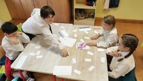 Children working at a desk together