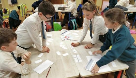 Children working at a desk together