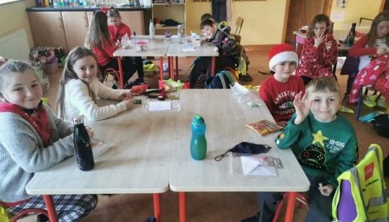Children sat at a table smiling