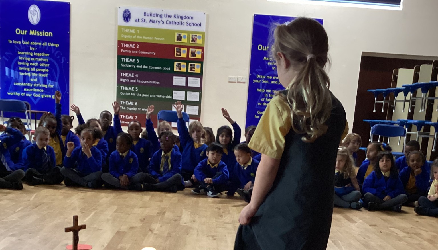 Children sat in a hall