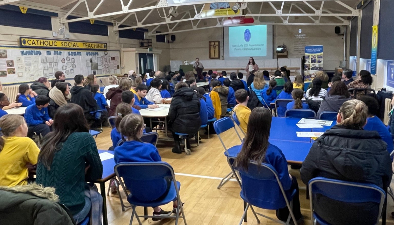 People sat in a hall