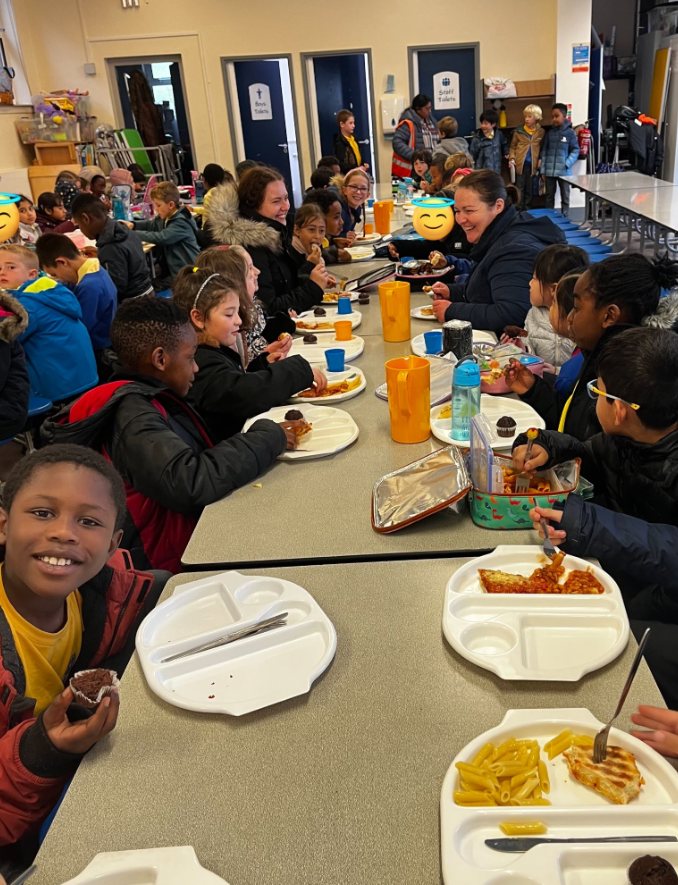 Children enjoying their hot meals in the canteen