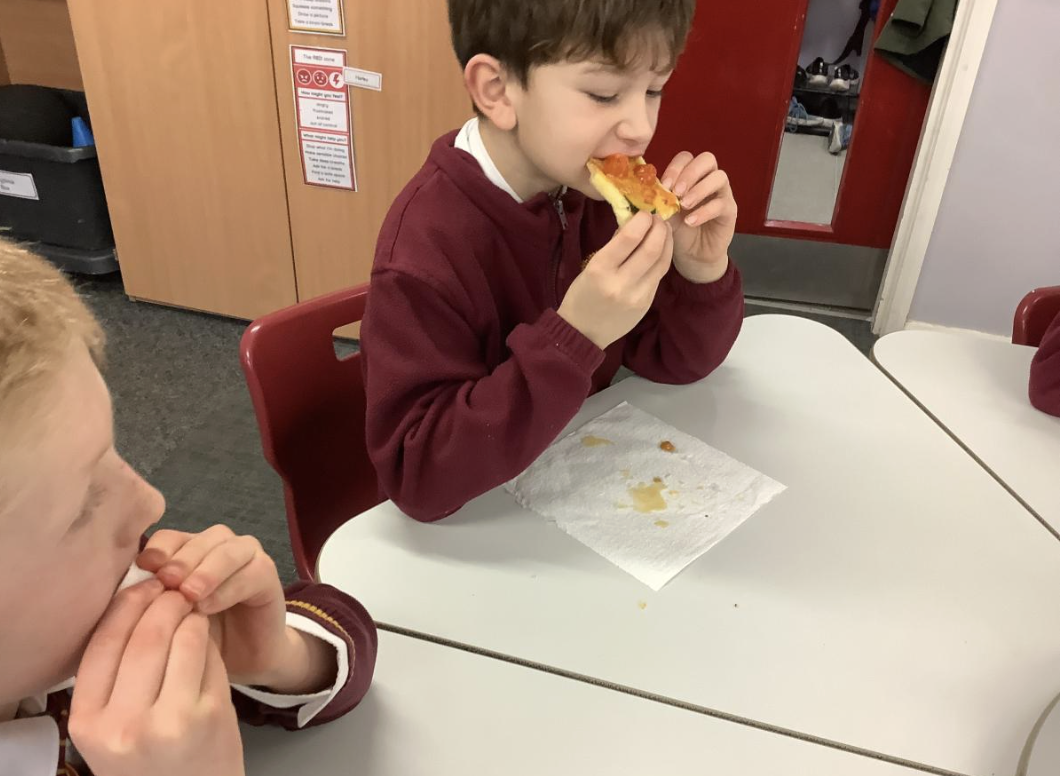 Pupil with the vegetable tart they designed in DT and baked.