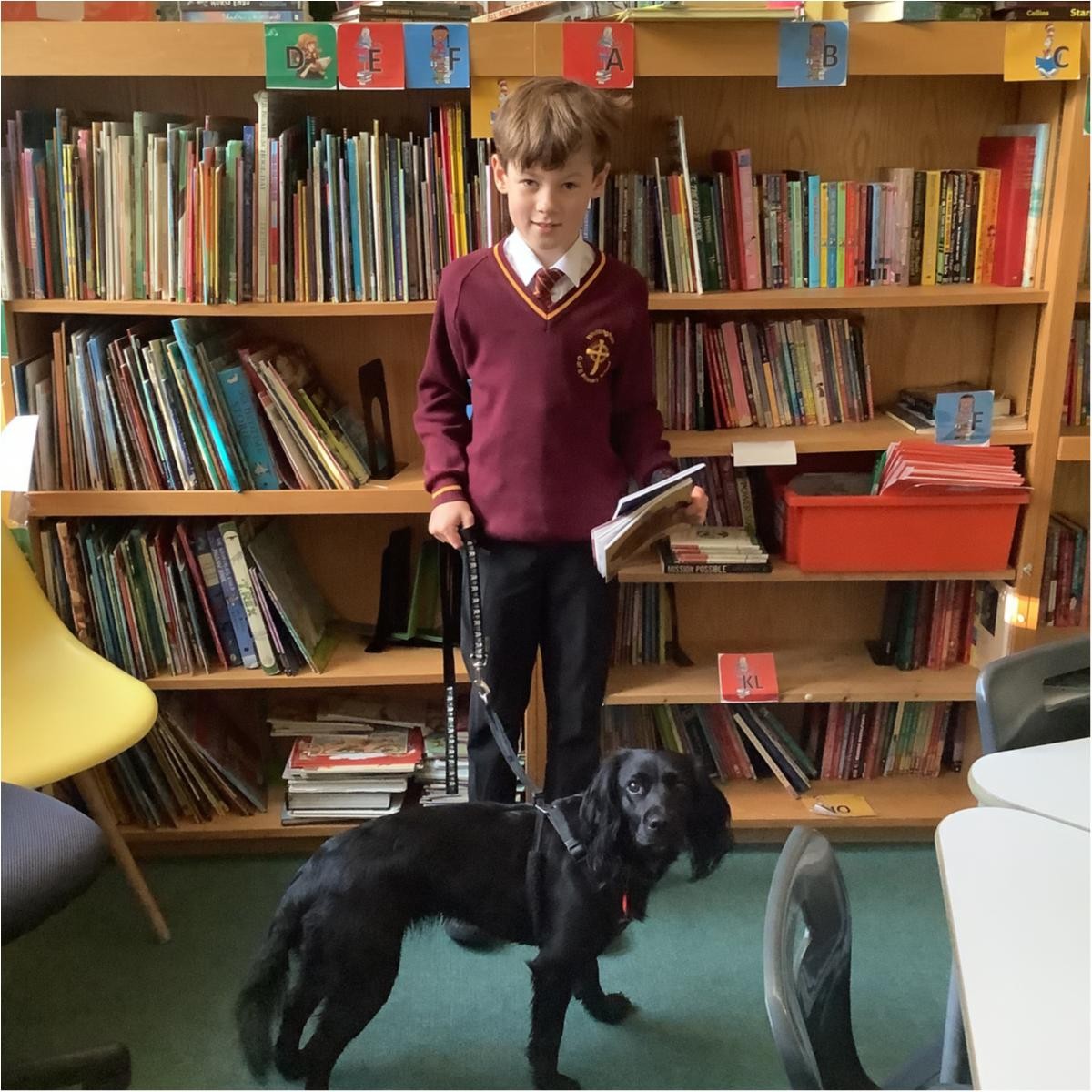 We celebrate reading and love it when Jess, our reading dog joins us.