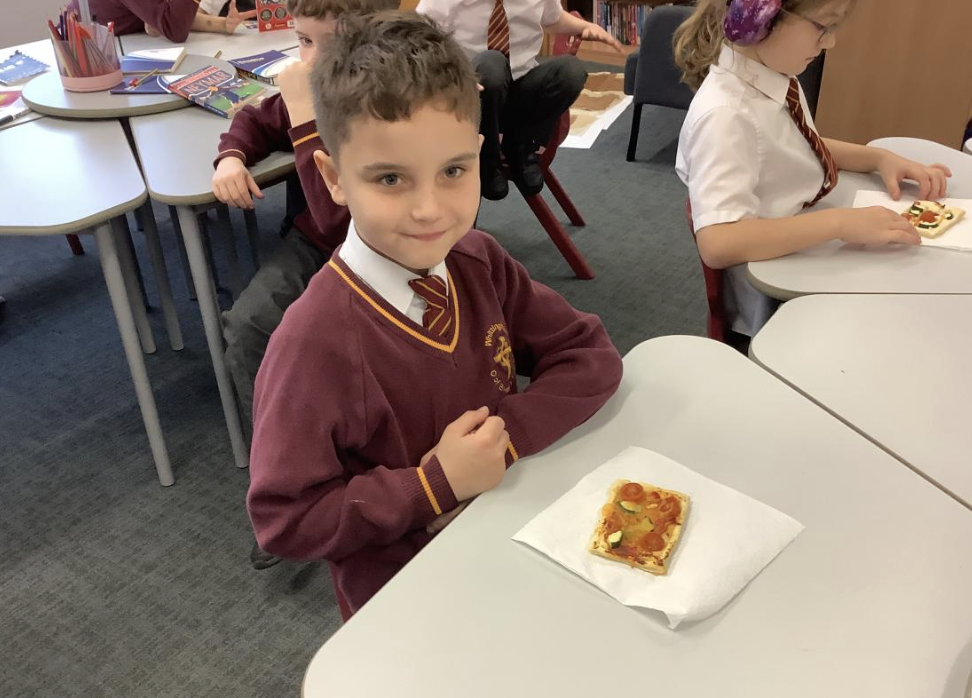 Pupil with the vegetable tart they designed in DT and baked.