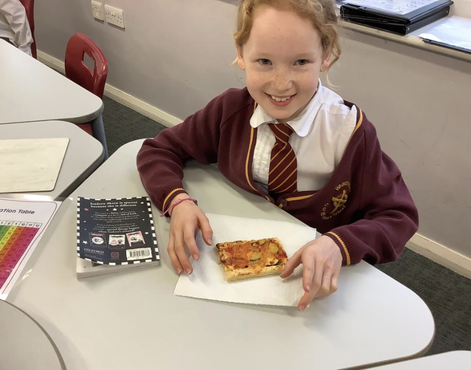 Pupil with the vegetable tart they designed in DT and baked.