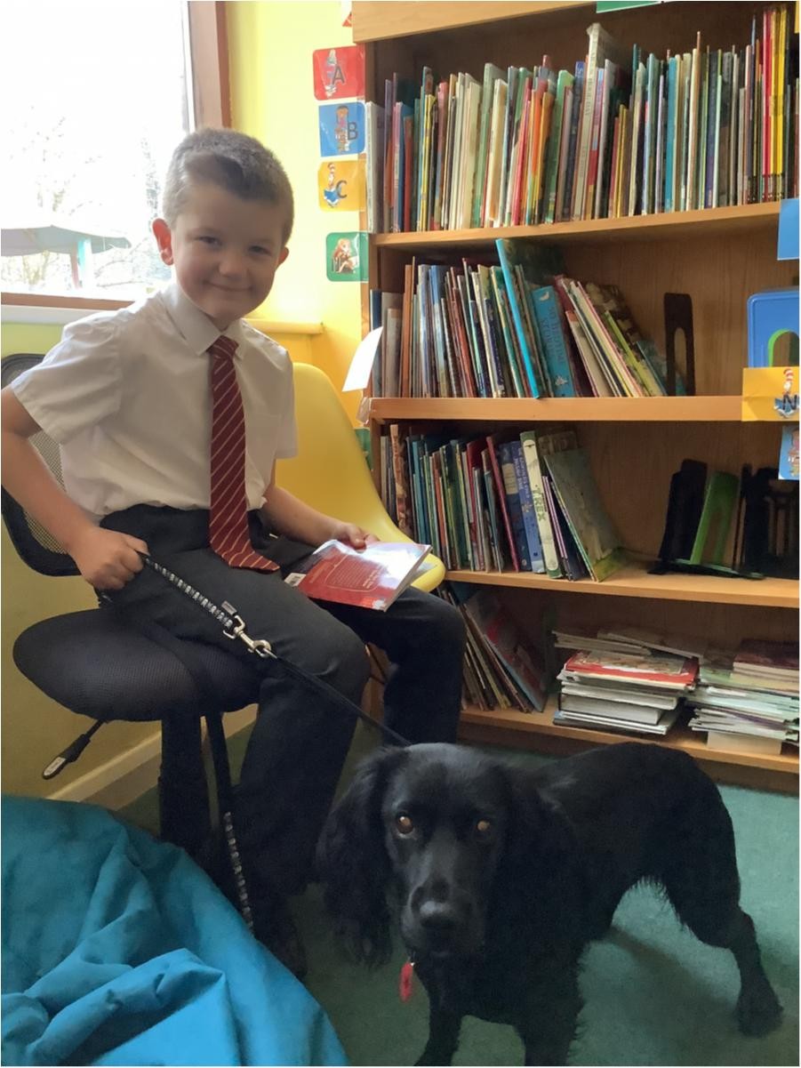 We celebrate reading and love it when Jess, our reading dog joins us.