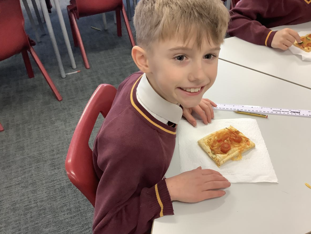 Pupil with the vegetable tart they designed in DT and baked.