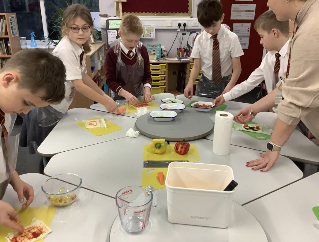 Pupils preparing vegetable tarts