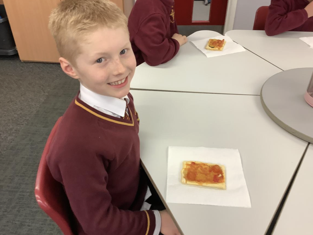 Pupil with the vegetable tart they designed in DT and baked.