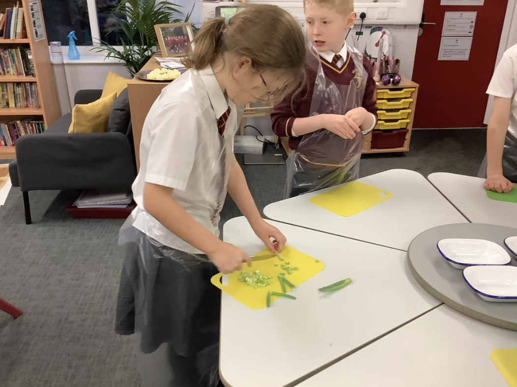 Pupils preparing vegetable tarts