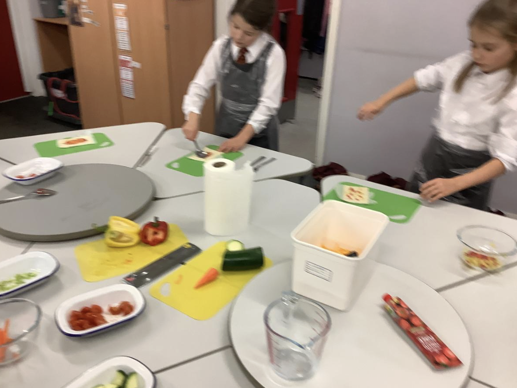 Pupils preparing vegetable tarts
