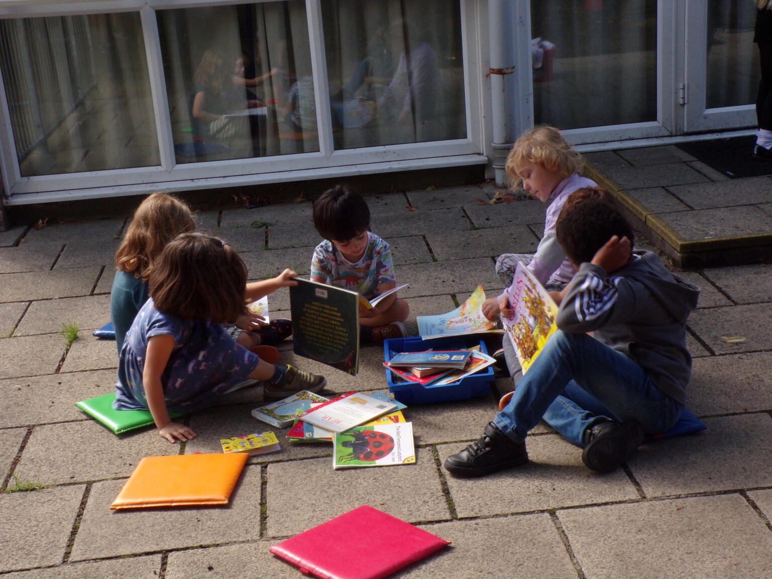 Reading on the playground. 