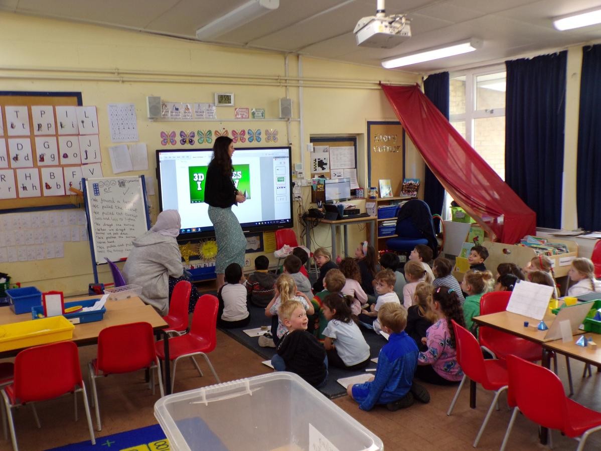 Children learning with Miss Ozakpinar in Class 1. 