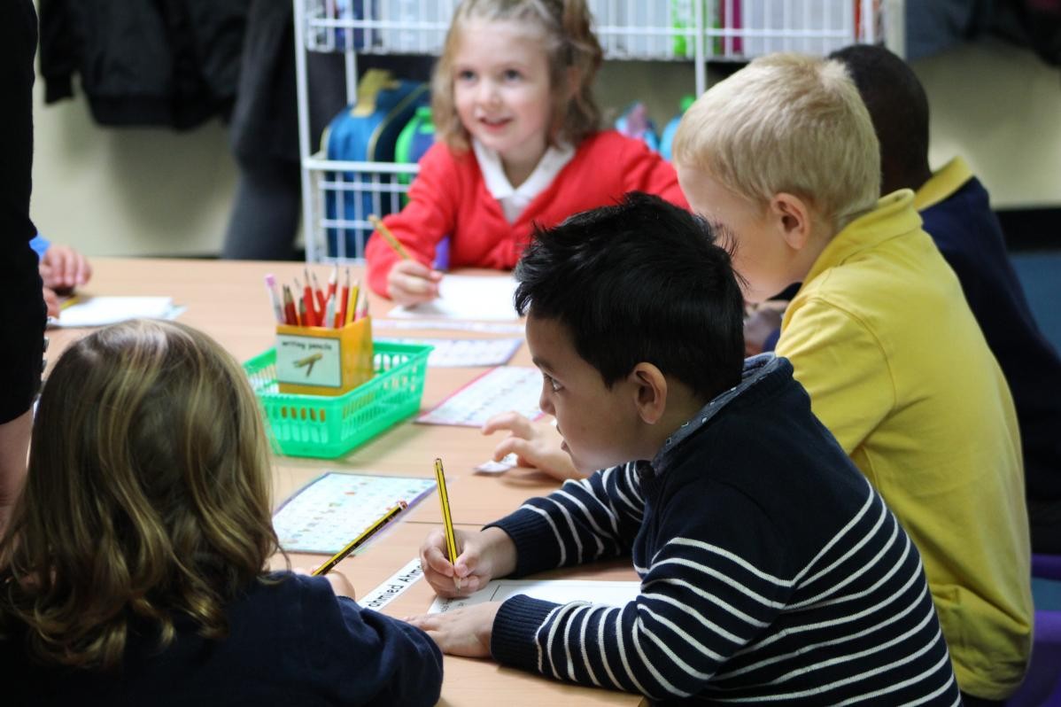 Children working alongside each other in class