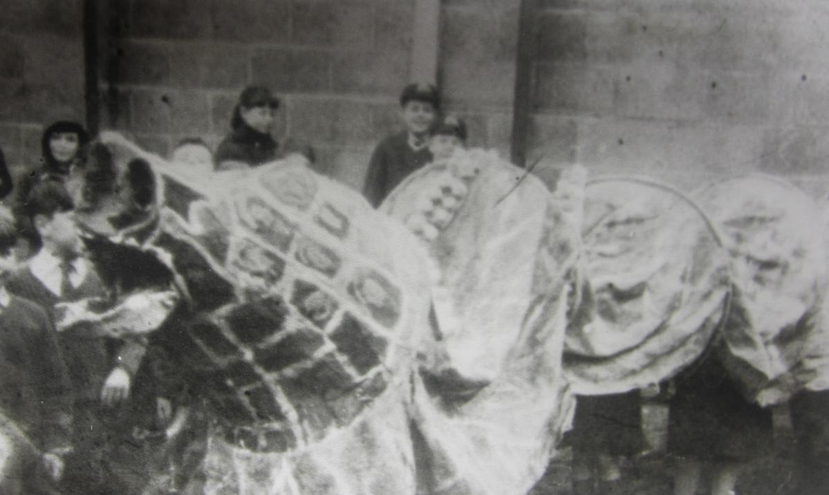 Pictures from old photo albums found in school. What were they doing? 