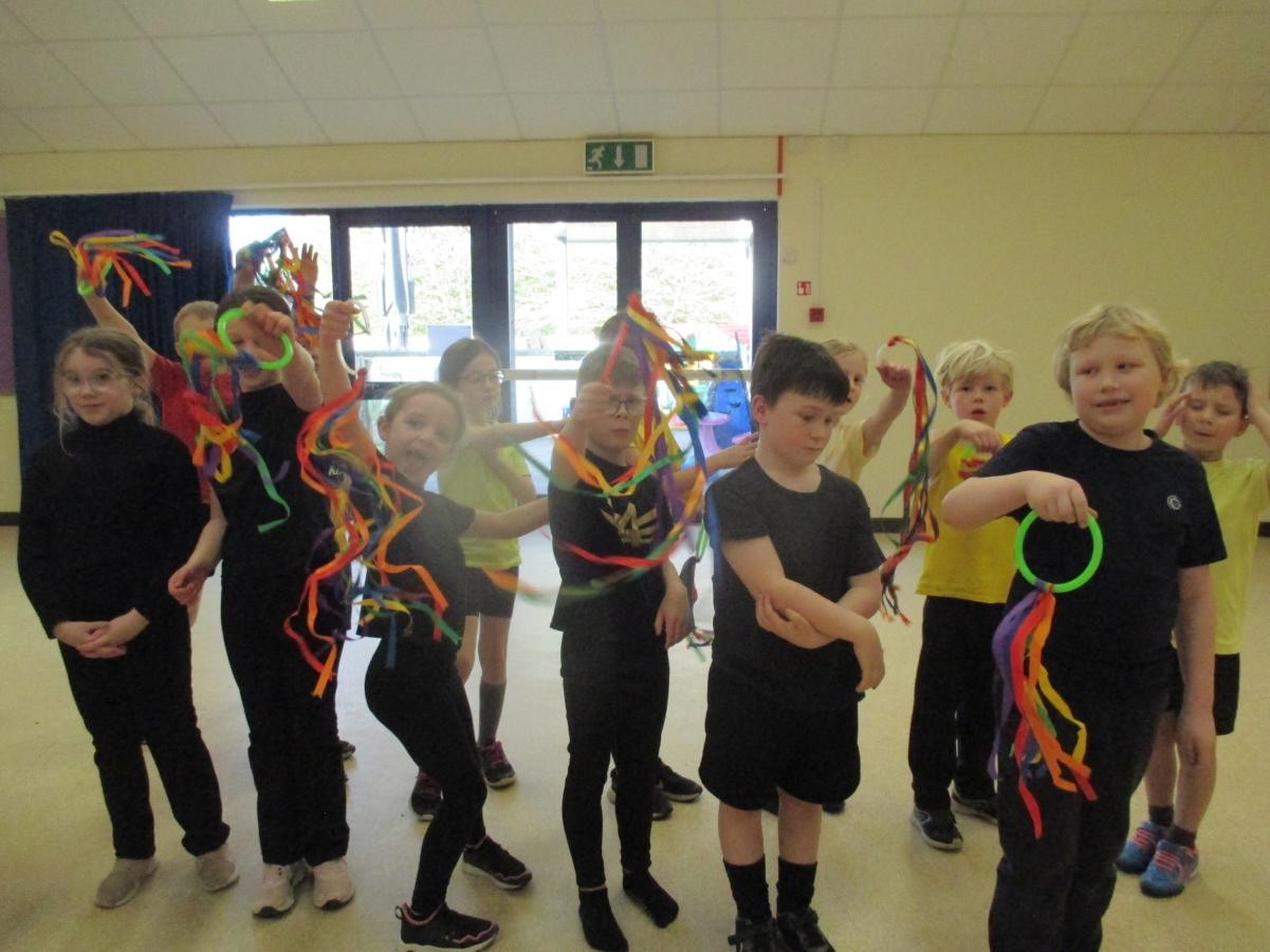We pretended to be a dragon and used brightly coloured ribbons to represent fireworks.