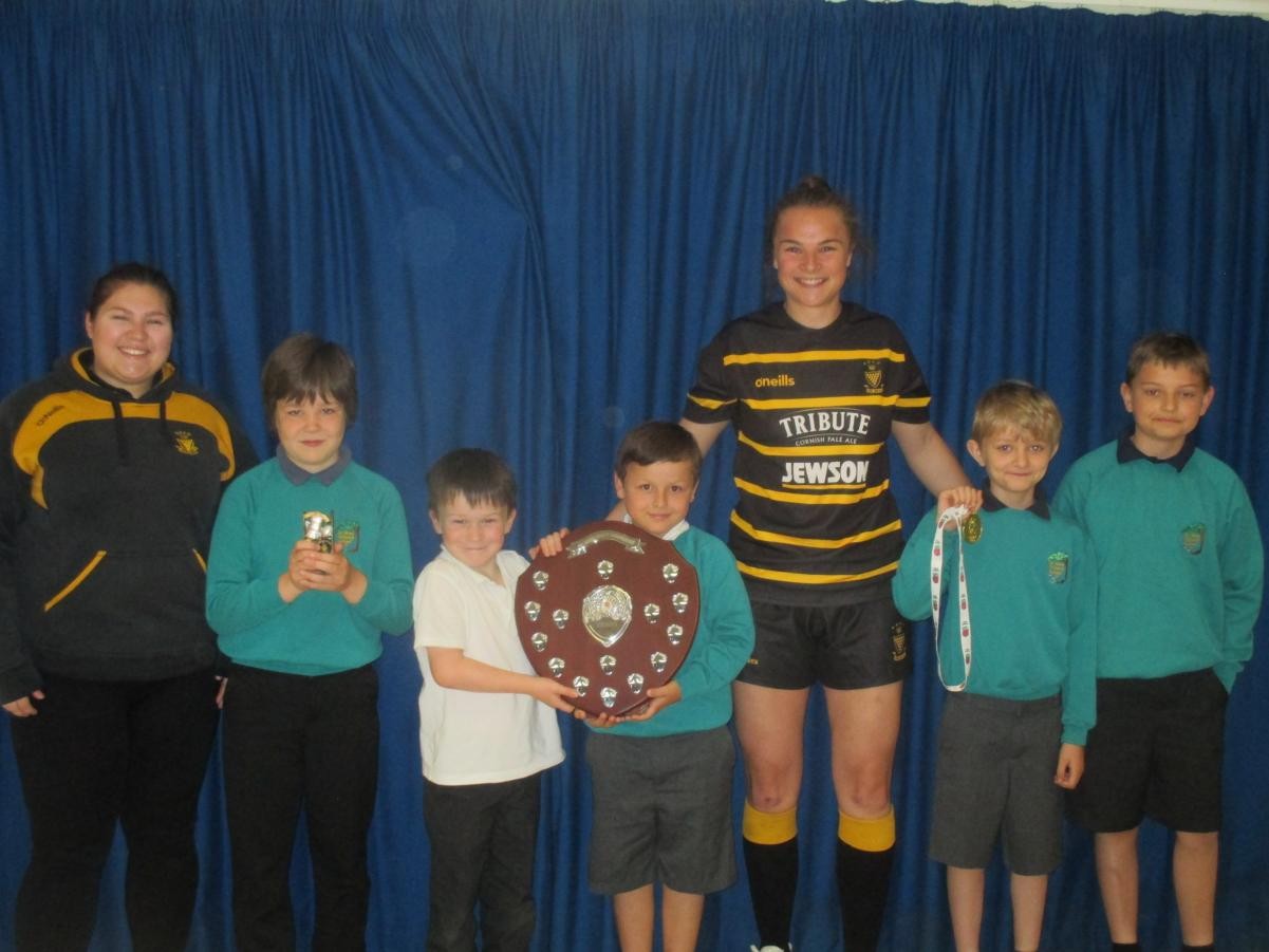 She showed us her medal and team trophy.