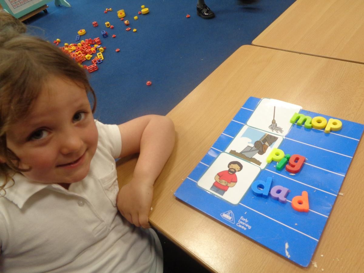 We use magnetic letters to spell words to match pictures.