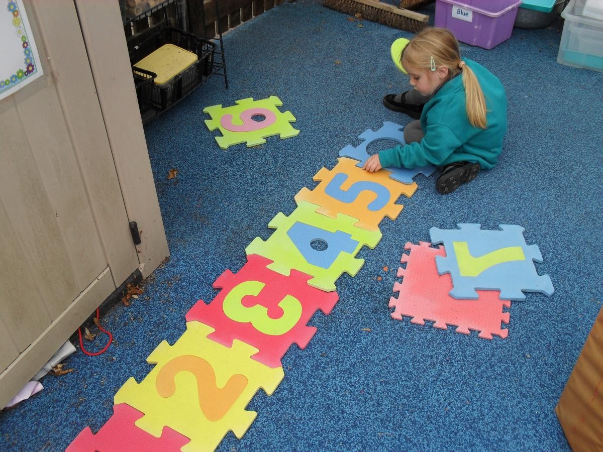 Iona worked hard to order the number tiles.