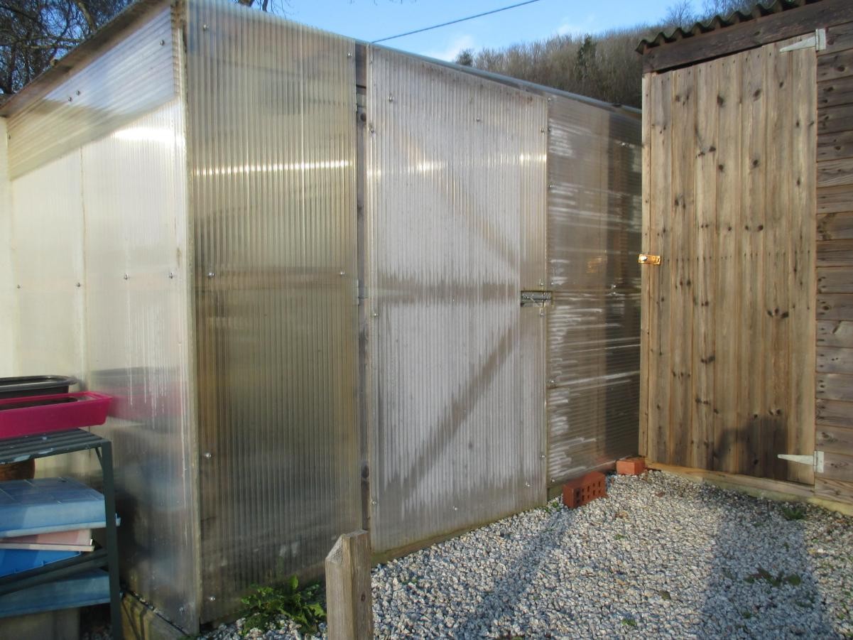Volunteers from our local community built us this polytunnel with recycled materials.